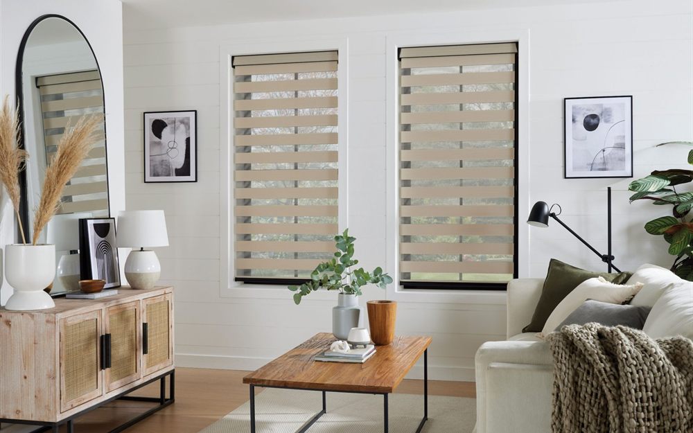 Beige combi blinds with alternating sheer and opaque bands in a styled living room